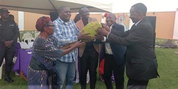 CP Supporter Ssali hands over Jackfruit to Mabirizi at Patel Shamji in Masaka city