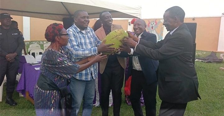 CP Supporter Ssali hands over Jackfruit to Mabirizi at Patel Shamji in Masaka city