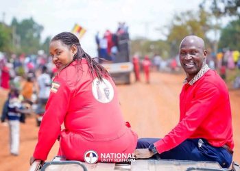 MP Brenda Nabukenya and Bamunanika County MP Robert Ssekitoleeko ride atop a vehicle during NUP presidential candidate Robert Kyagulanyi’s procession to a rally in Nakasongola.