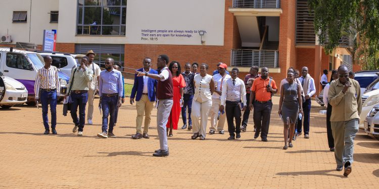Journalists tour Uganda Christian University’s Mukono Campus.