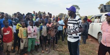 Mabirizi speaking to residents of Kiruli village in Kikamulo Sub County