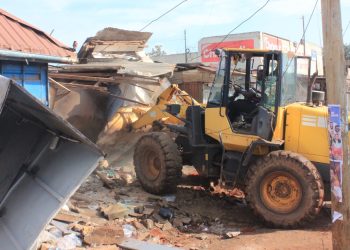 Authorities carry out an early morning demolition of roadside kiosks in Kikooza, Mukono Municipality, as part of an enforcement operation to clear illegal structures from road reserves.