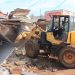 Authorities carry out an early morning demolition of roadside kiosks in Kikooza, Mukono Municipality, as part of an enforcement operation to clear illegal structures from road reserves.