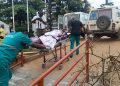 Francis Mpalanyi, Mukono municipal enforcement officer, is rushed to Mulago National Referral Hospital after sustaining severe head injuries during a kiosk demolition operation in Gunga Village