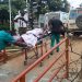 Francis Mpalanyi, Mukono municipal enforcement officer, is rushed to Mulago National Referral Hospital after sustaining severe head injuries during a kiosk demolition operation in Gunga Village