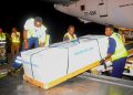 State Minister for Youth and Children Affairs Balaam Barugahara and family members receive the body of Timothy Muganzi Magambo, son of CID Director Tom Magambo, upon arrival at Entebbe International Airport on Tuesday morning.