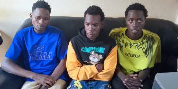 From left to right are Hassan Mugoya, Ashiraf Kyakatuka and Asuman Isanga detained at Iganga Central Police Station over alleged impersonation
