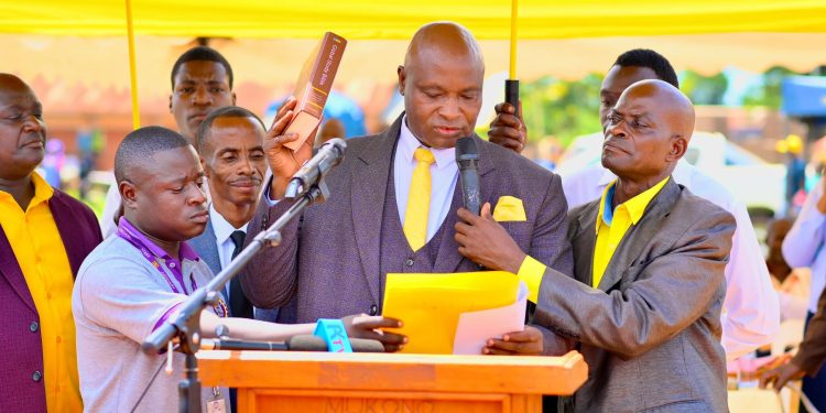 Francis Lukooya Mukoome takes oath during his swearing-in ceremony as Mukono District LC5 Chairperson.
