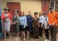 Stakeholders and disability rights activists pose for a group photo after addressing the media in Kampala
