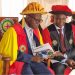 Rev. Fr. Prof. John Chrysotom Maviiri shares a moment with Peter Kiwanuka Bbosa during the 13th graduation ceremony