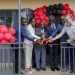Dorothy Ssemanda is joined by Rodrigo Jimenez and Sam Mwogeza to cut ribbon as a they launch the Katwe Noor Digital Community