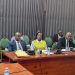 150 Local Government Officials Flagged Over Alleged Mismanagement, 40 Taken To Court KAMPALA – At least 150 local government officials have been flagged over alleged mismanagement, corruption and misuse of public resources, with 40 already facing prosecution before the Anti-Corruption Court. The Minister of Local Government, Balaam Barugahara Ateenyi, disclosed the figures while appearing before Parliament’s Public Accounts Committee (Local Governments), chaired by Mukono Municipality MP Betty Nambooze. Barugahara said nine additional case files are ready for submission to court, while 24 files are still being completed and 30 others remain under investigation. He said the figures do not include cases from West Nile and Budaka. According to the Minister, the cases were uncovered during field inspections in various local governments, where officials found alleged misuse of public funds, poorly executed projects and failures in supervision. Among the cases cited was a Shs73 million pit latrine project in Mulambuli, which Barugahara said was commissioned despite lacking a proper pit. He also cited a road project where laboratory tests allegedly found no suitable murram material, despite funds having already been spent on the works. Barugahara described some of the cases as evidence of syndicated corruption, in which several officials within local government structures allegedly fail to exercise their oversight responsibilities. “We should show these people that we know what you are doing, and it shall come for you,” Barugahara told the committee, warning that the government would take a tougher stance against officials involved in corruption and mismanagement. He further disclosed that investigations into financial irregularities had so far identified activities worth about Shs9.32 billion, with another Shs10 billion linked to a separate district. He said a forensic audit is being conducted to establish the actual amount involved through physical verification of roads and other government projects. PDM Funds Under Scrutiny The committee also raised concerns over alleged corruption and mismanagement in the implementation of the Parish Development Model (PDM), citing findings contained in the Auditor General’s reports. The audit identified cases in which some beneficiaries allegedly received PDM funds more than once, while others failed to procure the required assets. The committee also cited cases involving non-existent projects and the diversion of PDM funds to activities that were not eligible for financing under the programme. Nambooze said the scale of local government operations makes it impossible for the Minister to personally supervise every district, placing greater responsibility on the Ministry’s technical leadership. She urged the Ministry to ensure that officials implicated in corruption are thoroughly investigated and, where evidence supports the allegations, prosecuted. Nambooze warned against relying solely on interdictions, saying officials can eventually return to their positions if investigations are not concluded. She also questioned why reports from District Public Accounts Committees do not consistently reach Parliament, saying this limits lawmakers’ ability to obtain a comprehensive picture of accountability failures in local governments. MPs Asked To Strengthen Oversight Minister of State for Local Government Justine Nameere called on MPs to strengthen oversight of government projects in their constituencies by regularly visiting project sites and demanding accountability from implementers. Nameere pointed to differences in the quality and cost of government-funded construction projects as evidence of weak supervision. She cited a three-storey structure in Namagunga that she said was constructed at a cost of about Shs900 million, contrasting it with another project where only a slab and a few pillars had been completed despite substantial expenditure. She said closer monitoring by elected leaders could help expose poor workmanship, inflated costs and other forms of mismanagement before public funds are lost. Nameere also raised concerns over alleged corruption within District Service Commissions, saying some job seekers have reportedly been asked to pay money in exchange for government employment. She said some families have sold property in an attempt to secure jobs for their children, only to lose their money without the promised employment. Calls For Institutional Reform Permanent Secretary in the Ministry of Local Government Ben Kumumanya said accountability failures should not be attributed to a single individual because several institutions and officials have legally mandated responsibilities. He said the Ministry needs to review the existing accountability system, restructure ineffective structures and strengthen institutions responsible for inspection, auditing and oversight. “The time for restructuring, the time for policy reform, the time for reform is now,” Kumumanya said. The committee also questioned the independence of District Public Accounts Committees. Vice Chairperson Abed Nasser Mudiobole argued that allowing district councils to appoint committees that later scrutinise the councils’ performance creates a potential conflict of interest. He proposed amendments to the Local Government Act to strengthen the independence of the committees, including a proposal for the losing political side in LC5 elections to nominate members. Staffing Gaps Hamper Oversight The committee further raised concerns over understaffing, particularly in critical positions such as internal auditors and engineers. Nambooze said some local governments have critically low staffing levels. She cited Mukono Municipality, where she said only about five percent of the required civil servants are in place and one engineer serves the municipality and its two divisions. The Ministry, however, said staffing levels across local governments have improved from 60 percent in June 2022 to 70 percent by June 2026. Staffing at the Ministry’s headquarters currently stands at 91 percent, according to officials. The Ministry said it will continue recruiting for critical positions, strengthen inspections, improve follow-up on audit and parliamentary recommendations, enhance records management and intensify risk-based supervision. Barugahara also called for stronger coordination between central government ministries and local governments, particularly for projects contracted by central government agencies but implemented in districts. He said local government engineers should be involved in supervising such projects to ensure value for money and prevent central government agencies from shifting responsibility to districts when projects fail. Barugahara said the government would continue working with Parliament and other oversight institutions to address corruption, recover misappropriated public resources and improve service delivery. The committee, meanwhile, urged the Ministry to ensure investigations are concluded and officials found culpable are prosecuted, stressing that accountability should go beyond interdictions to include prosecution and recovery of public funds.