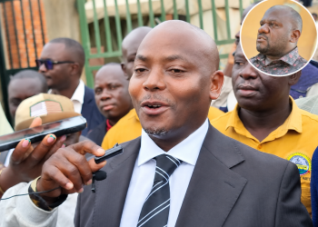 Kibuule addressing media. In circle is Kiwanuka