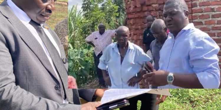 Njeru Municipality Deputy RDC Richard Kakwezi and Njeru Municipality Planner Edmond Musoke at Kilyowa Village in Njeru Municipality Buikwe District.