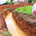 Jesca Nalujja, the 12-year-old girl who reportedly died after falling into an uncovered pit at the GLA Stone Quarry in Kiwugo Village, Nakisunga Sub-county, Mukono District, is pictured in a circle alongside part of the trench leading to the quarry site.